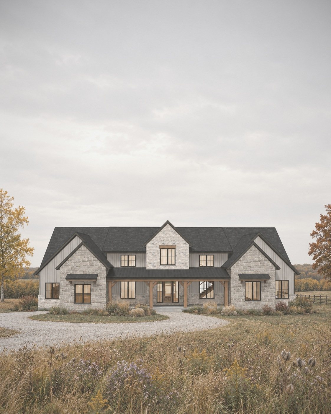 Stone and board-and-batten farmhouse in an autumn meadow under a soft overcast sky